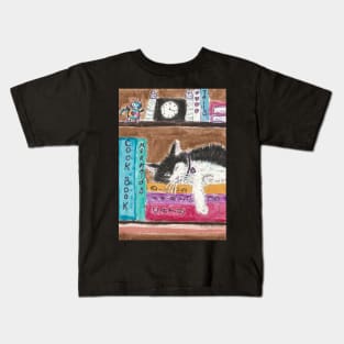 Kitty cat sleeping on books Kids T-Shirt